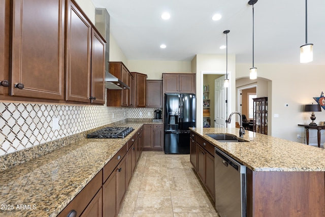 kitchen featuring gas cooktop, a sink, decorative backsplash, dishwasher, and black refrigerator with ice dispenser