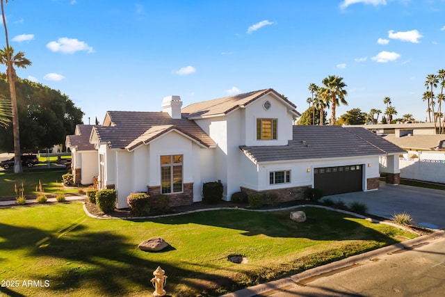 view of front of home with a garage, stone siding, a tile roof, and driveway