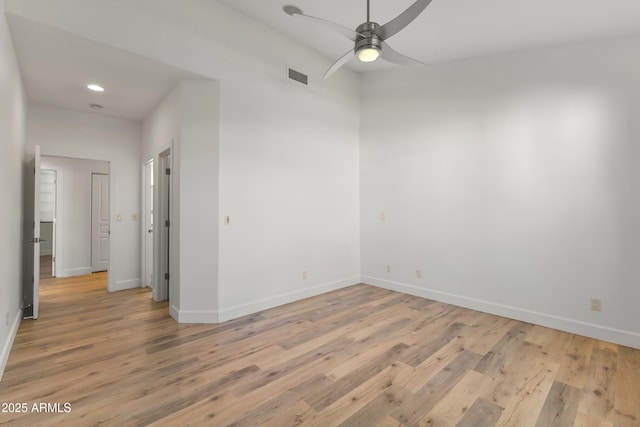 spare room featuring recessed lighting, visible vents, light wood-style flooring, ceiling fan, and baseboards