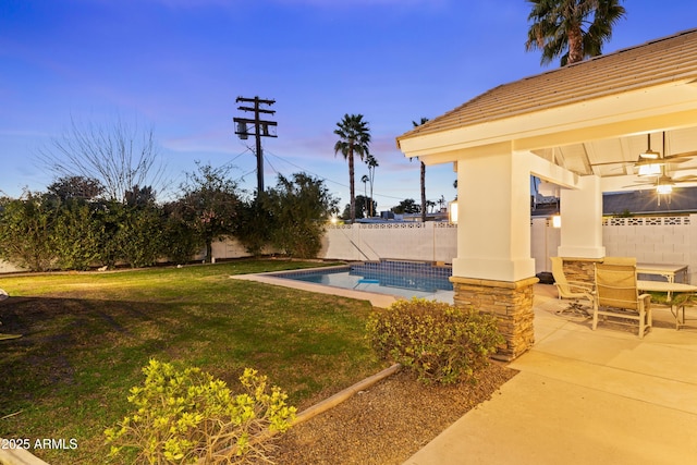 view of swimming pool featuring a patio area, a fenced backyard, a fenced in pool, and a yard