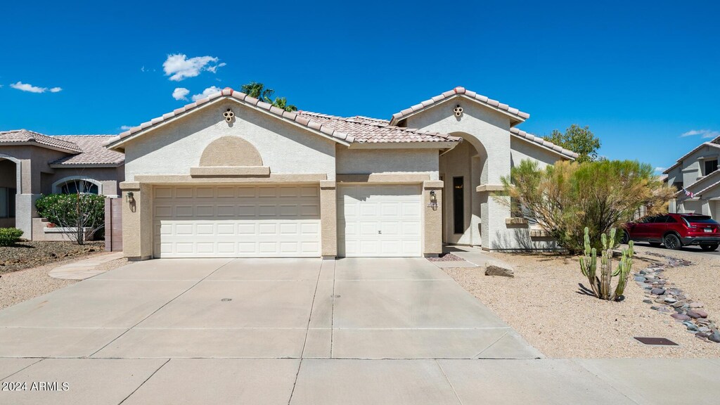 view of front of property with a garage