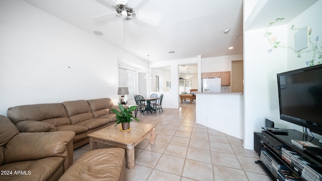 tiled living room featuring ceiling fan