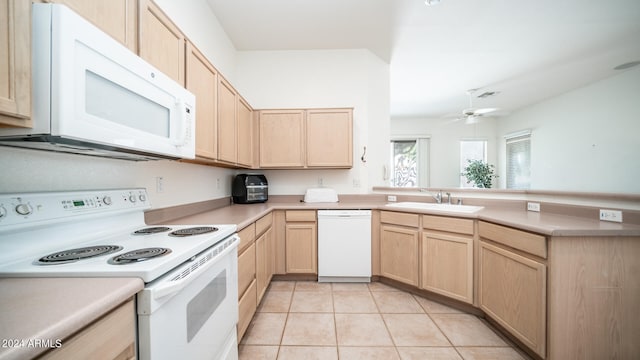 kitchen featuring light brown cabinetry, white appliances, ceiling fan, sink, and light tile patterned flooring