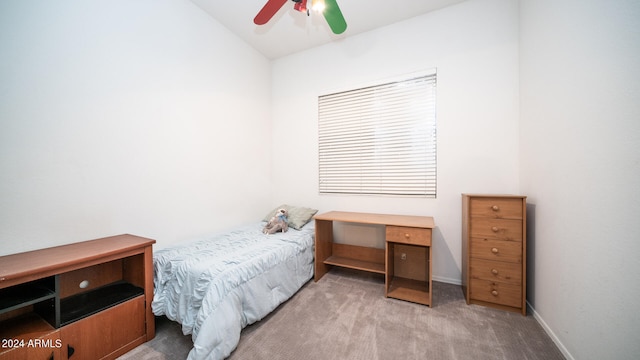 bedroom featuring ceiling fan, light colored carpet, and vaulted ceiling