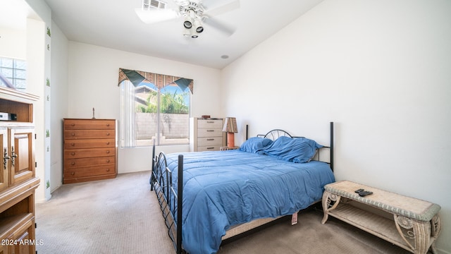 bedroom featuring ceiling fan, light colored carpet, and lofted ceiling