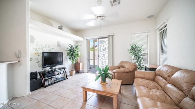 living room with light tile patterned floors and ceiling fan