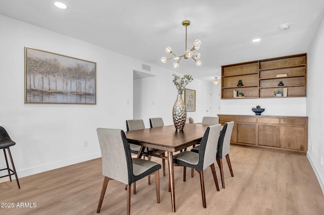 2712 N 20th Dr, Phoenix, AZ 85009 - dining room featuring a chandelier, light wood-type flooring, and recessed lighting