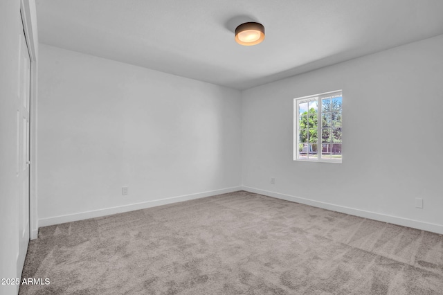 2712 N 20th Dr, Phoenix, AZ 85009 - carpeted empty room with baseboards