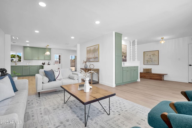 2712 N 20th Dr, Phoenix, AZ 85009 - living area featuring light wood-type flooring and recessed lighting