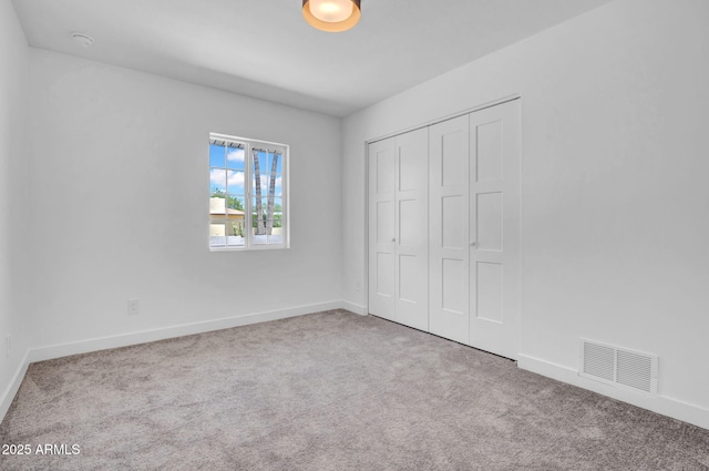 2712 N 20th Dr, Phoenix, AZ 85009 - unfurnished bedroom featuring carpet flooring and a closet