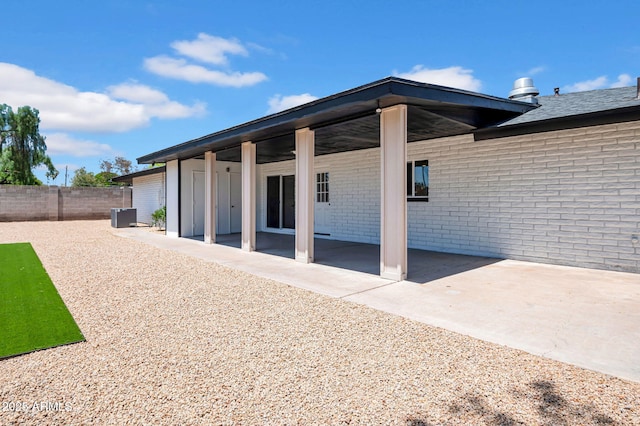 2712 N 20th Dr, Phoenix, AZ 85009 - rear view of property featuring a patio and brick siding