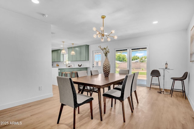 2712 N 20th Dr, Phoenix, AZ 85009 - dining room with a chandelier, light wood-style flooring, and recessed lighting