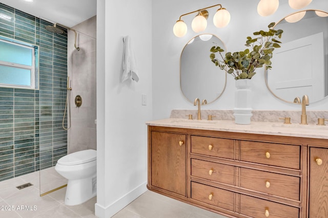 2712 N 20th Dr, Phoenix, AZ 85009 - bathroom featuring tile patterned floors, double vanity, and a tile shower