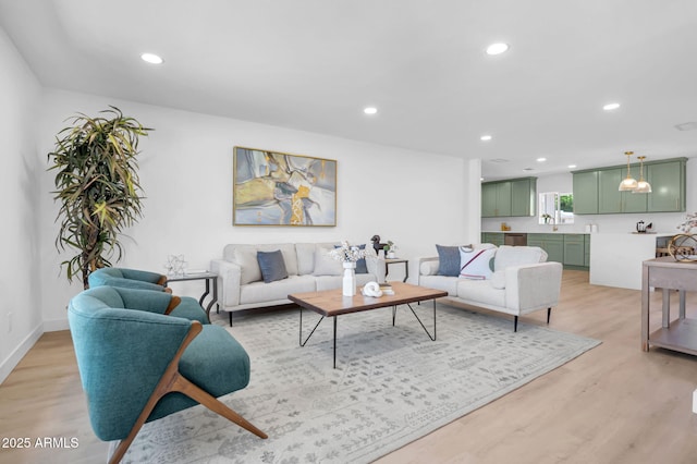 2712 N 20th Dr, Phoenix, AZ 85009 - living area with light wood-style flooring and recessed lighting