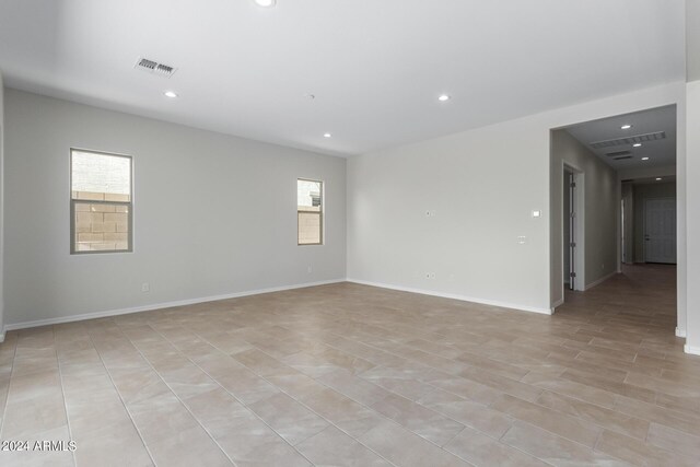 empty room with light tile patterned floors