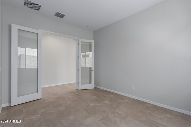 unfurnished bedroom featuring light tile patterned floors