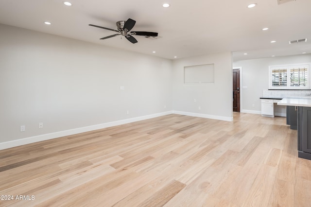 interior space featuring ceiling fan, light hardwood / wood-style flooring, and built in desk