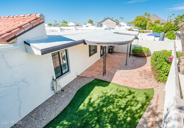 back of house featuring a patio