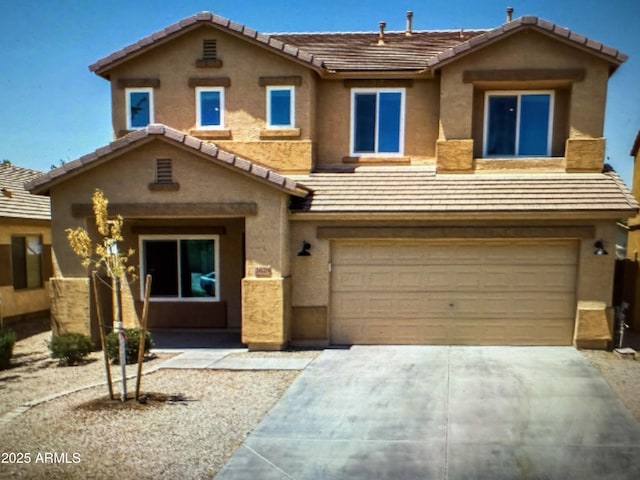 2628 W Jasper Butte Dr, San Tan Valley, AZ 85144 - view of front of home featuring an attached garage, a tile roof, concrete driveway, and stucco siding