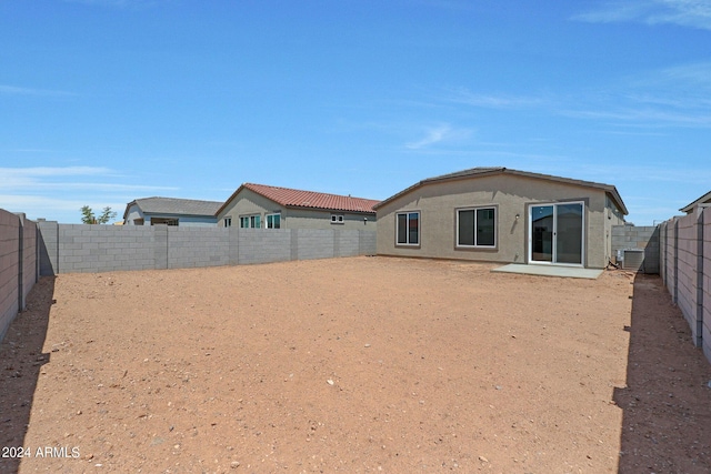 18052 W Sand Hills Rd, Surprise, AZ 85387 - back of house featuring central AC, a fenced backyard, and stucco siding