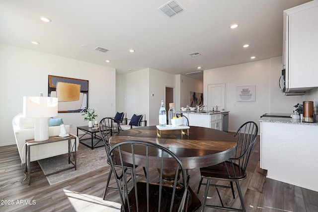 18052 W Sand Hills Rd, Surprise, AZ 85387 - dining room with wood finished floors, visible vents, and recessed lighting