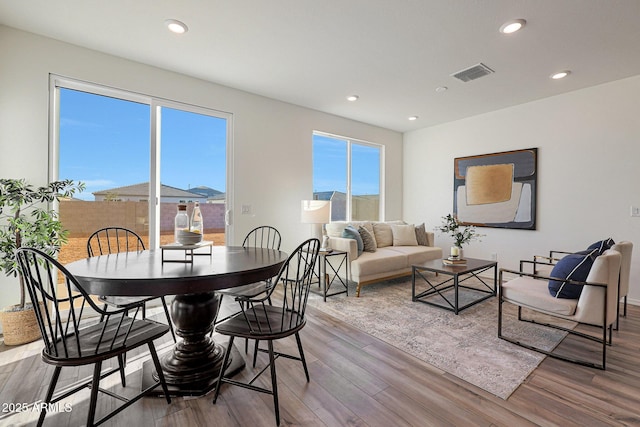 18052 W Sand Hills Rd, Surprise, AZ 85387 - dining space with recessed lighting, wood finished floors, and visible vents