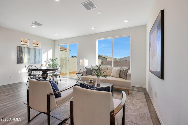 18052 W Sand Hills Rd, Surprise, AZ 85387 - living area featuring wood finished floors, visible vents, and baseboards