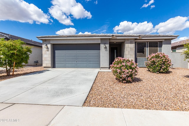 ranch-style house featuring a garage