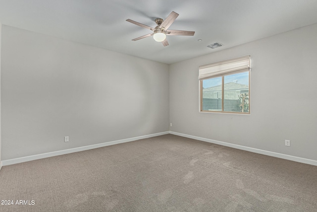 unfurnished room with light carpet and ceiling fan