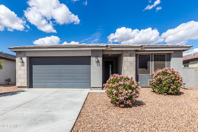 ranch-style house featuring a garage