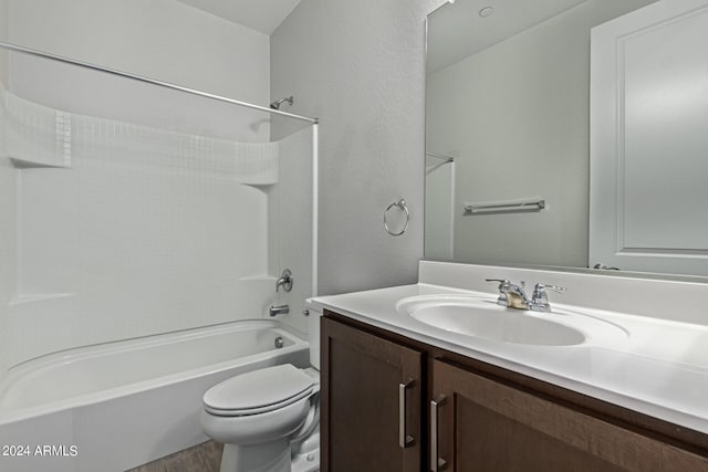 full bathroom featuring shower / bathtub combination, toilet, hardwood / wood-style floors, and vanity