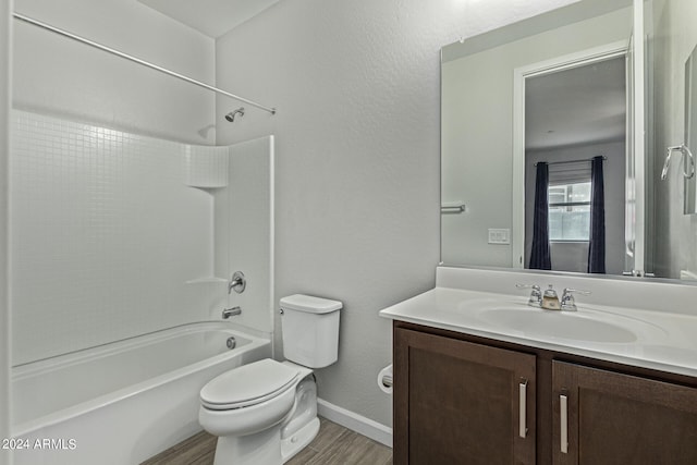 full bathroom featuring shower / washtub combination, toilet, vanity, and wood-type flooring