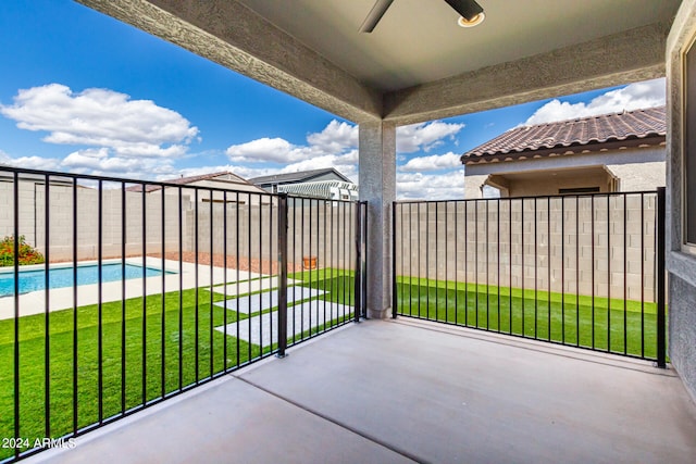 balcony with a fenced in pool