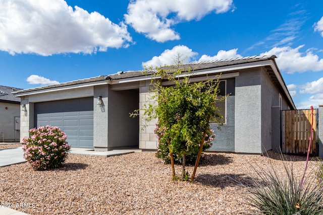 ranch-style home with a garage