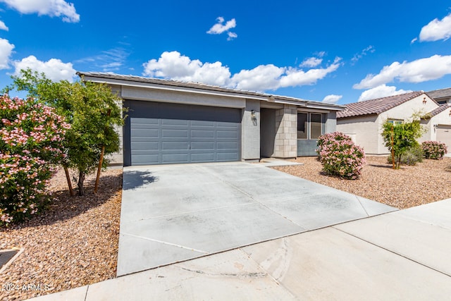 ranch-style house featuring a garage