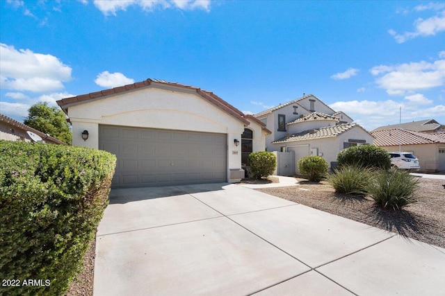 mediterranean / spanish-style home featuring a garage