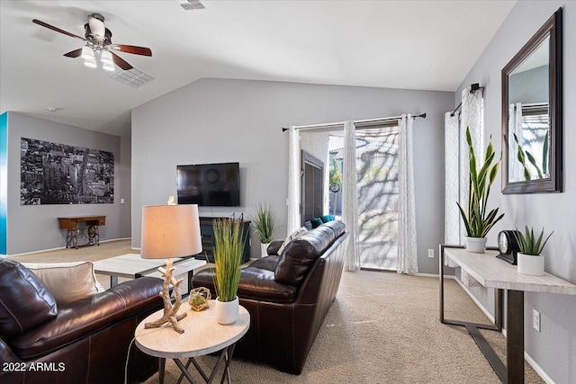 carpeted living room with lofted ceiling and ceiling fan