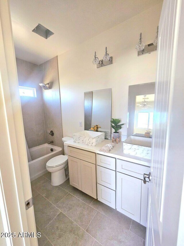 38167 W San Juan Ave, Tonopah, AZ 85354 - full bathroom featuring plenty of natural light, double vanity, tile patterned floors, and toilet