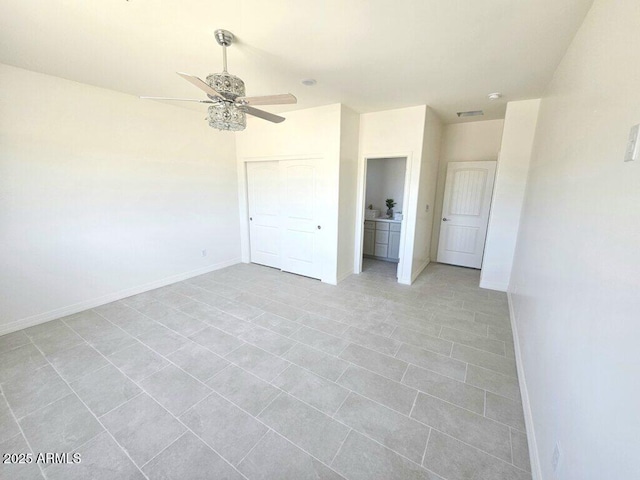 38167 W San Juan Ave, Tonopah, AZ 85354 - unfurnished bedroom featuring baseboards, a ceiling fan, and a closet