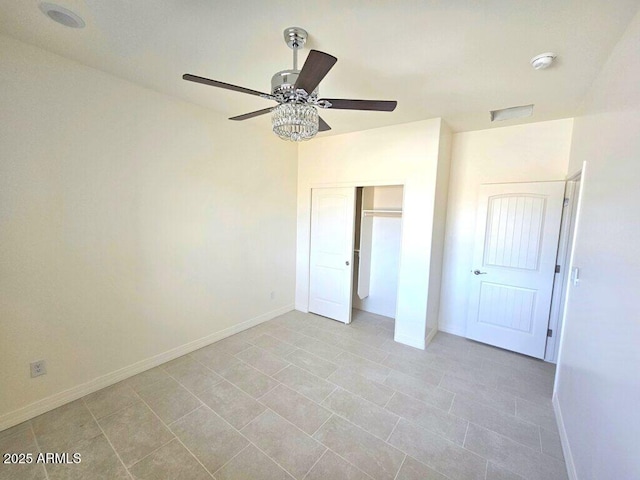 38167 W San Juan Ave, Tonopah, AZ 85354 - unfurnished bedroom with baseboards, a closet, a ceiling fan, and light tile patterned flooring