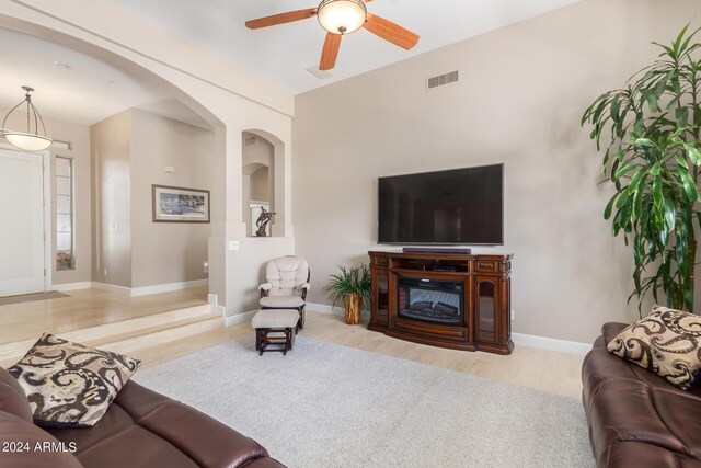 living room with a notable chandelier and light carpet