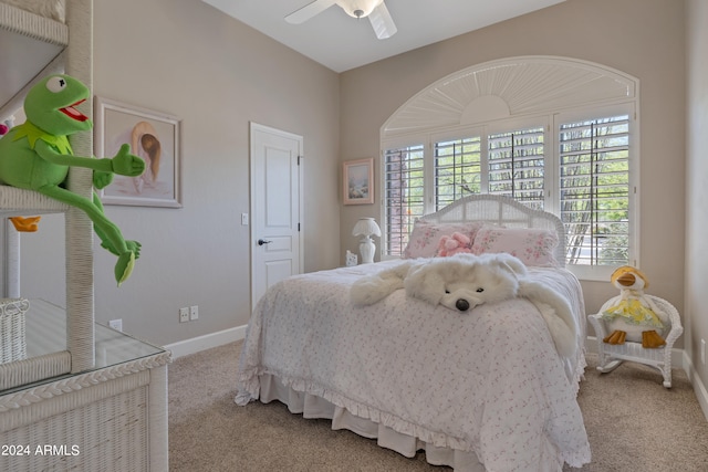 carpeted bedroom with multiple windows and ceiling fan