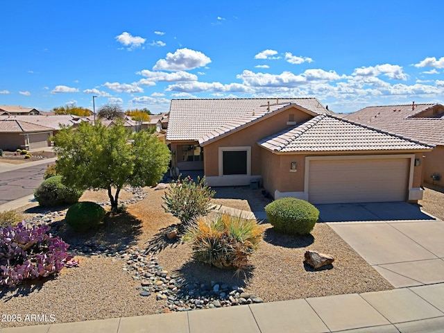 5049 E Duane Ln, Cave Creek, AZ 85331 - single story home featuring a garage, stucco siding, concrete driveway, and a tile roof
