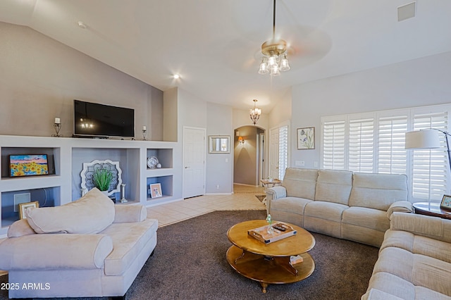 5049 E Duane Ln, Cave Creek, AZ 85331 - living area featuring arched walkways, ceiling fan, tile patterned floors, and vaulted ceiling