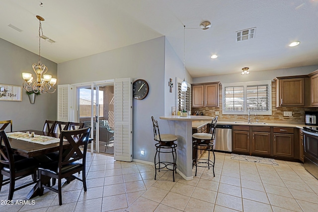 5049 E Duane Ln, Cave Creek, AZ 85331 - dining area with an inviting chandelier, baseboards, light tile patterned floors, lofted ceiling, and visible vents