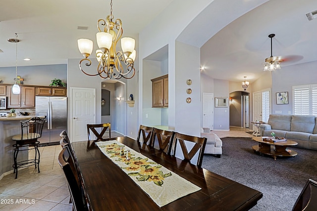 5049 E Duane Ln, Cave Creek, AZ 85331 - dining space with visible vents, arched walkways, light tile patterned floors, baseboards, and ceiling fan with notable chandelier