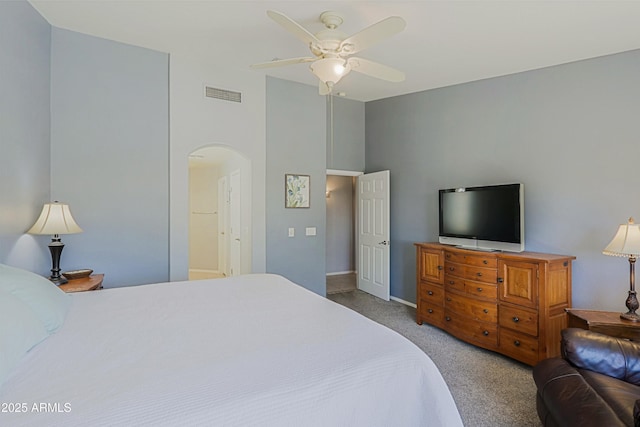 5049 E Duane Ln, Cave Creek, AZ 85331 - bedroom featuring arched walkways, carpet, a ceiling fan, baseboards, and visible vents