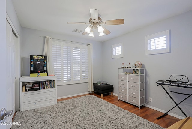 5049 E Duane Ln, Cave Creek, AZ 85331 - bedroom featuring visible vents, a closet, baseboards, ceiling fan, and dark wood-style floors
