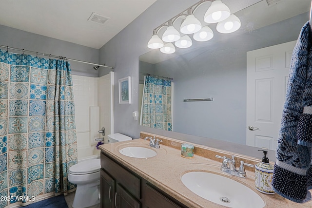 5049 E Duane Ln, Cave Creek, AZ 85331 - bathroom with a sink, toilet, double vanity, and visible vents