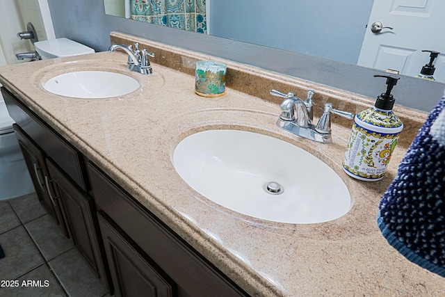 5049 E Duane Ln, Cave Creek, AZ 85331 - bathroom featuring double vanity, toilet, a sink, and tile patterned flooring